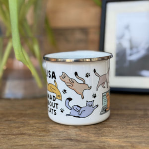 A tin mug with colourful wraparound cat designs With name & text 'Mad about Cats'