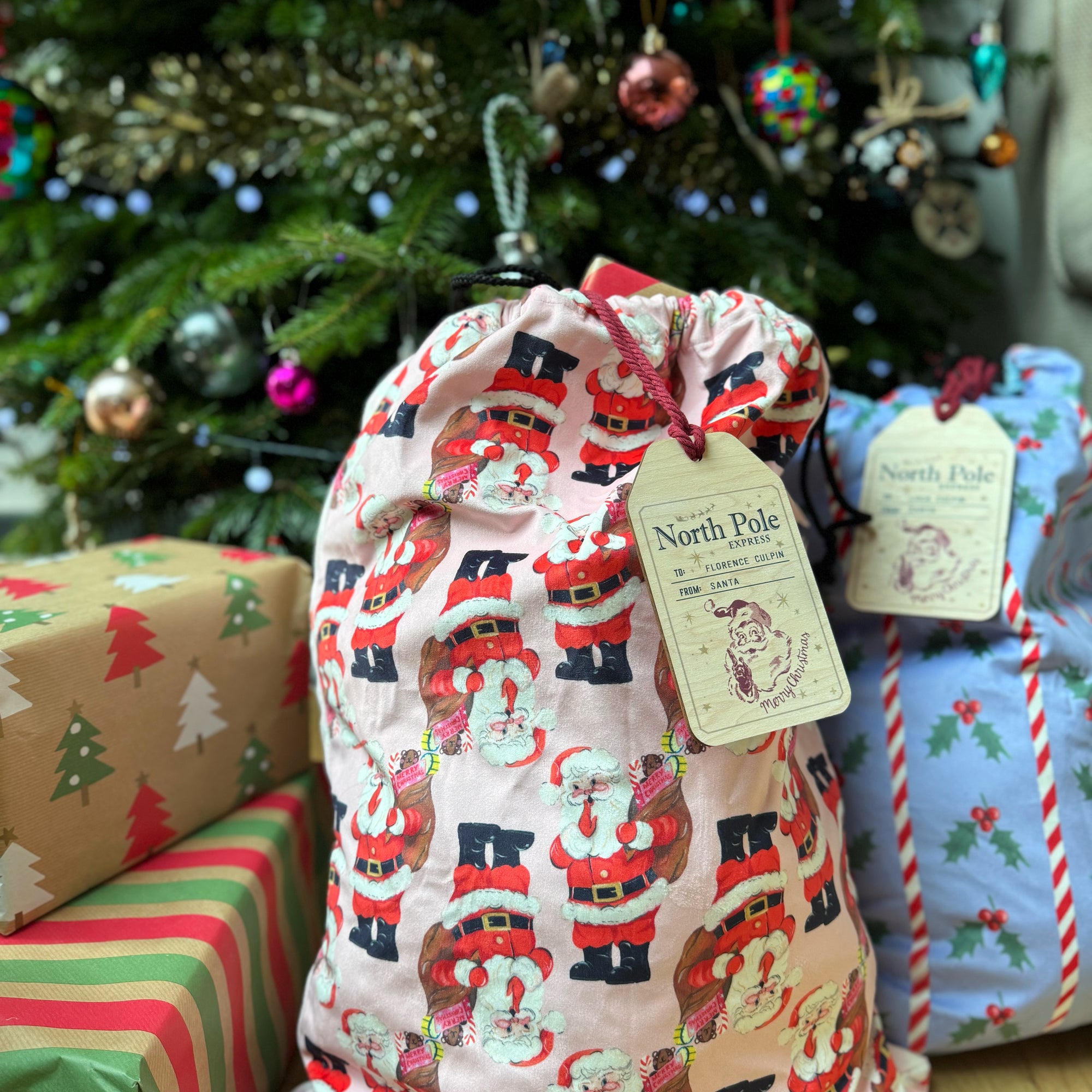 Christmas sack tags under the christmas tree