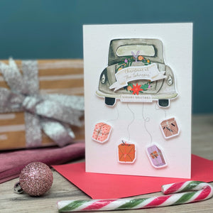 Luxury Personalised Christmas Card With Classic car & presents hanging