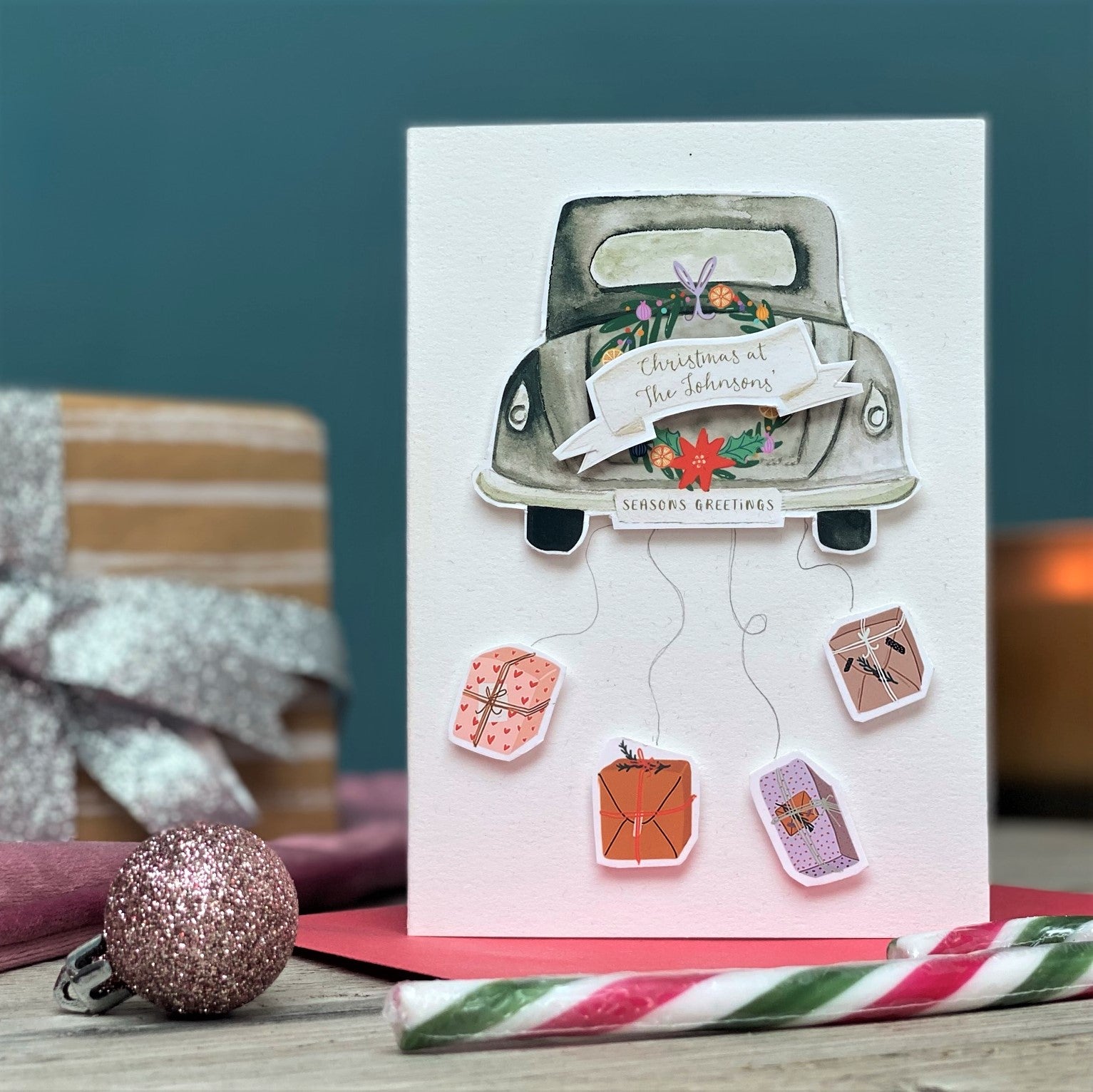 Luxury Personalised Christmas Card With Classic car & presents hanging