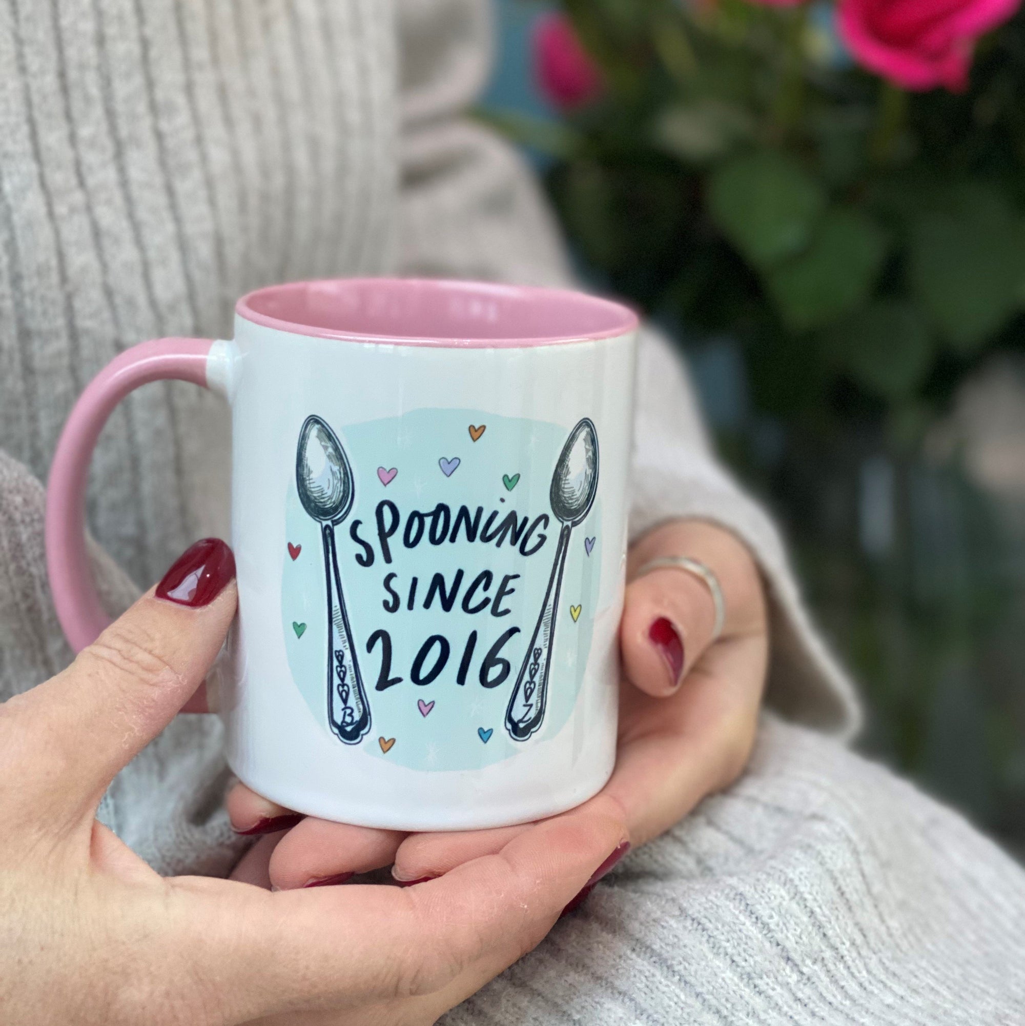 Person holding Pink and white China Mug with Spooning since with personalised date