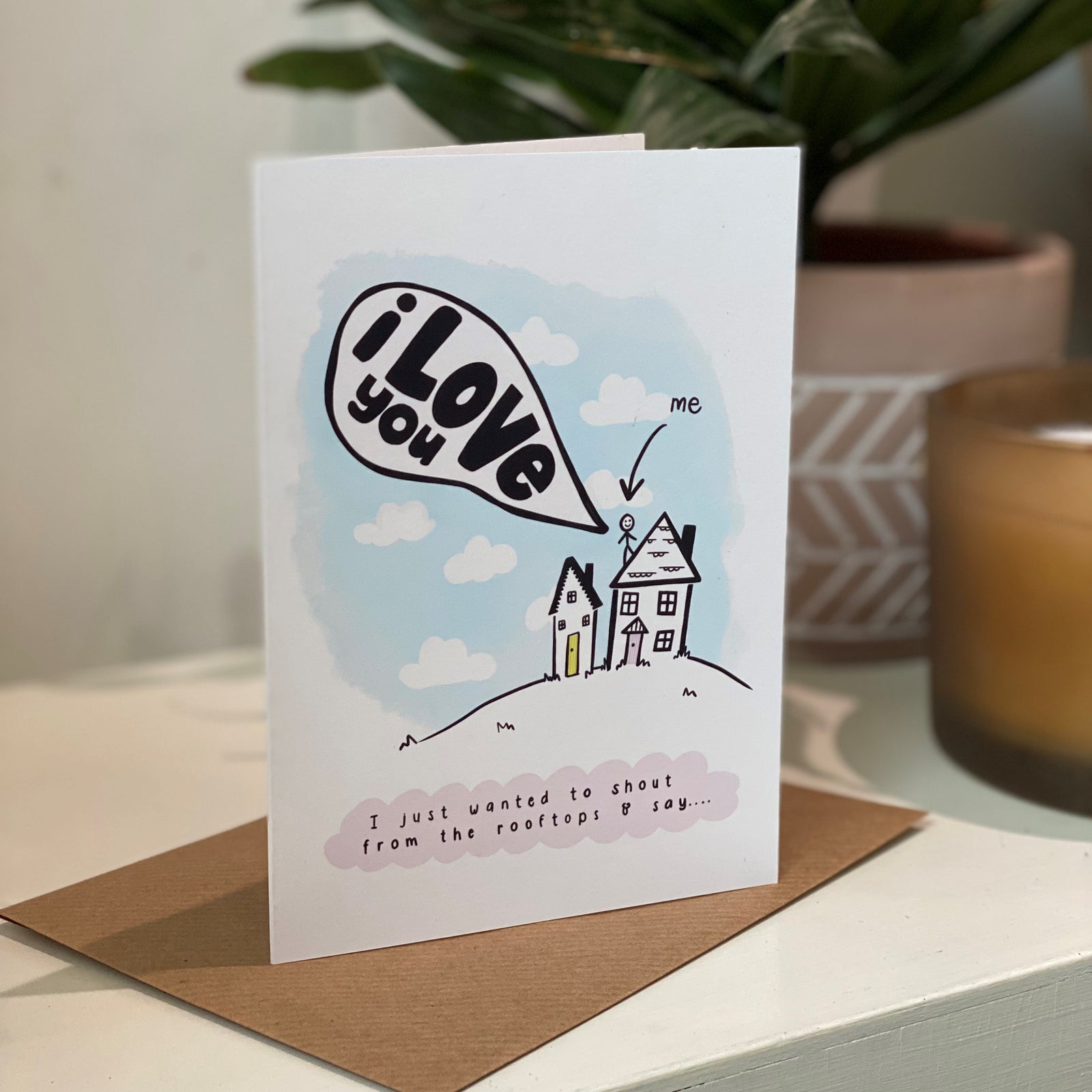 i love you card with illustration of stickperson shouting from the rooftop