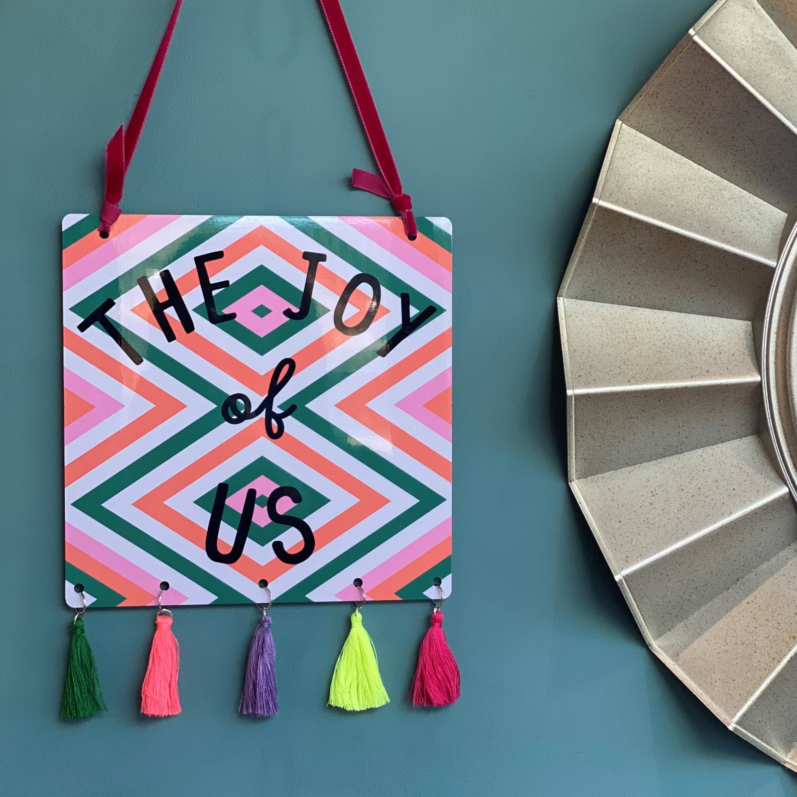 The Joy Of Us Tasselled Geometric Sign Orange And Pink