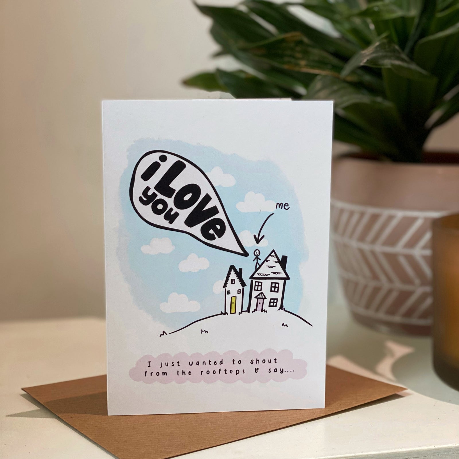 i love you card with illustration of stickperson shouting from the rooftop